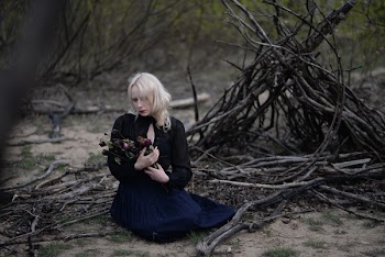 Woman Holding Red Flowers