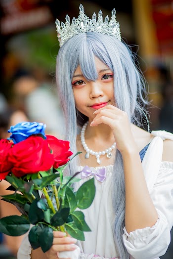Woman Holding Red Flowers