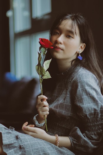 Woman Holding Red Rose