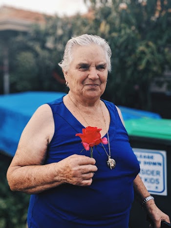 Woman Holding Red Rose