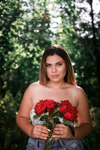 Woman Holding Red Roses