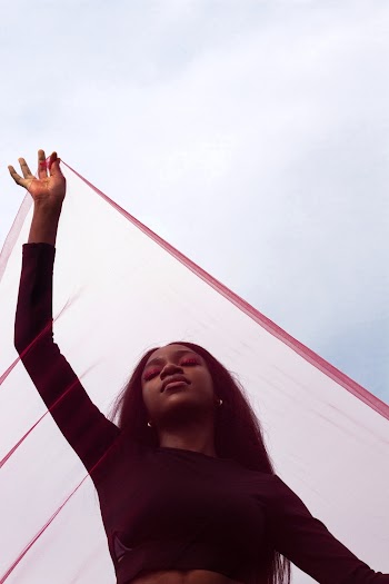 Woman Holding Sheer Textile