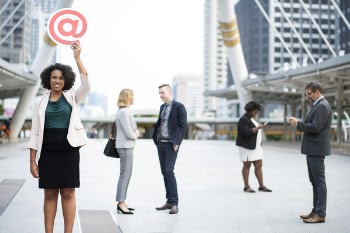 Woman Holding @ Signage While Raising Up