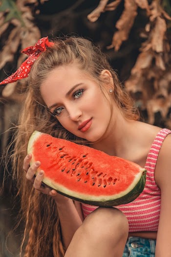 Woman Holding Sliced Watermelon