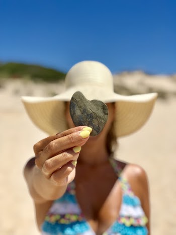 Woman Holding Smooth Stone