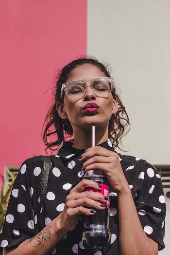 Woman Holding Soda Bottle