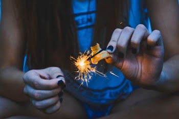 woman holding sparkler