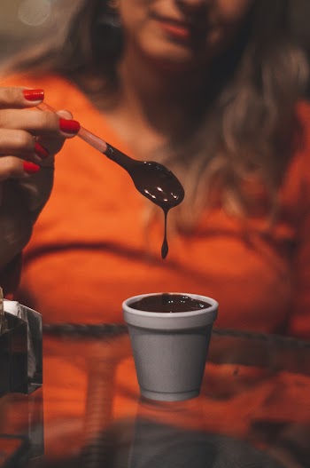 Woman Holding Spoon