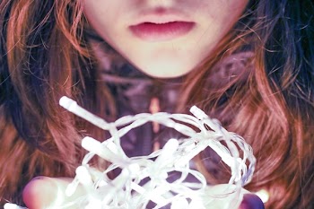 Woman Holding String Light