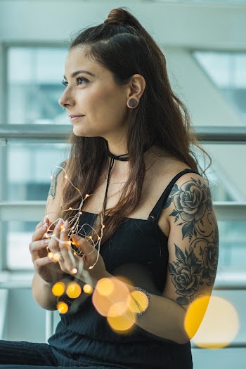 Woman Holding String Lights