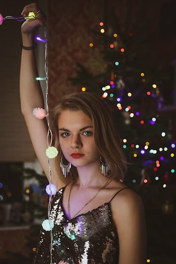 Woman Holding String Lights