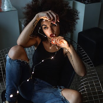 Woman Holding String Lights