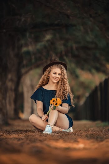 Woman Holding Sunflowers