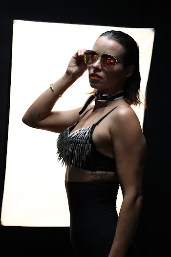 Woman Holding Sunglasses