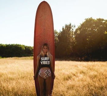 woman holding surfboard