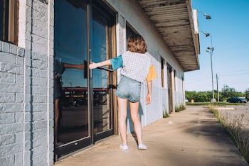 Woman Holding The Door