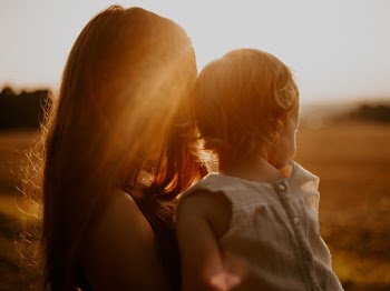Woman Holding Toddler