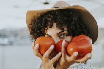 Woman Holding Tomatoes