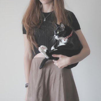Woman Holding Tuxedo Cat