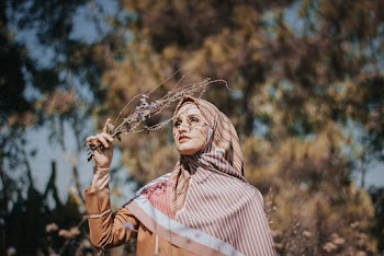 Woman Holding Twigs