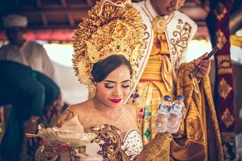Woman Holding Two Plastic Water Bottles