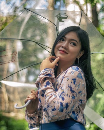 Woman Holding Umbrella On Focus Photography