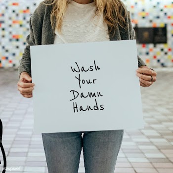 Woman holding wash your damn hands sign during the coronavirus outbrea.. | Free  psd mockup - 2330315