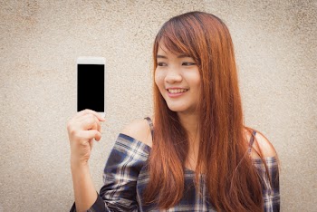 Woman Holding White Android Smartphone