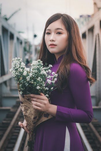Woman Holding White Baby's Breath Flowers