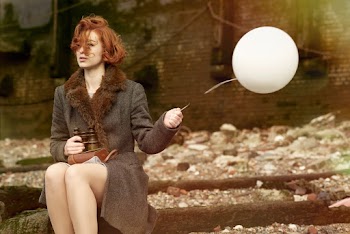 Woman Holding White Balloon