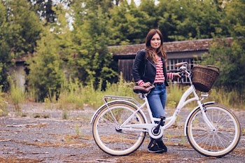 Woman Holding White Bicycle