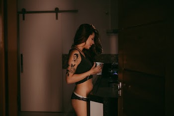 Woman Holding White Ceramic Mug
