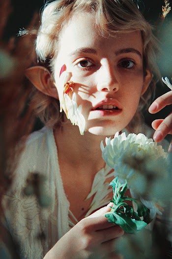 Woman Holding White Flower