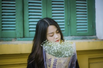 Woman Holding White Flower Bouquet