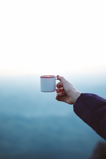 Woman Holding White Mug