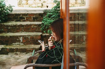 Woman Holding White Smartphone