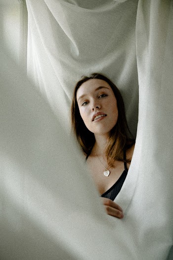 Woman Holding White Textile