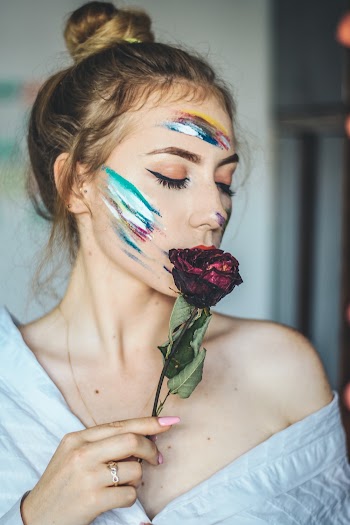 Woman Holding Withered Rose
