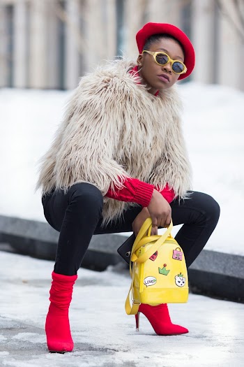 Woman Holding Yellow Backpack