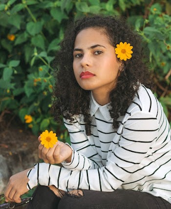 Woman Holding Yellow Flower