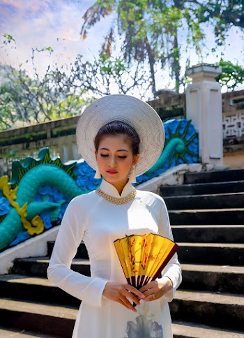Woman Holding Yellow Hand Fan