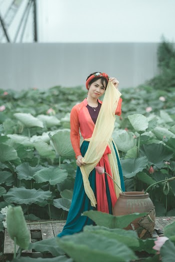 Woman Holding Yellow Scarf