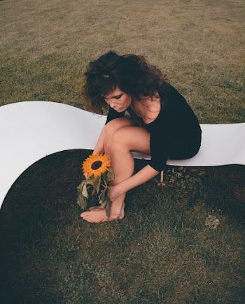 Woman Holding Yellow Sunflower