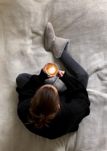 Woman Holds a Cup With Espresso