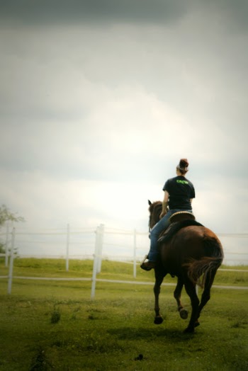 Woman Horse Backriding on Grass Lawn