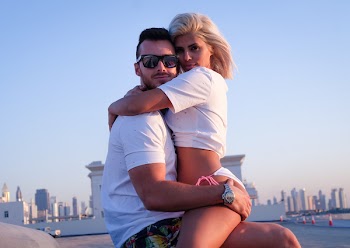 Woman Hugged the Man Sitting on Concrete Pavement