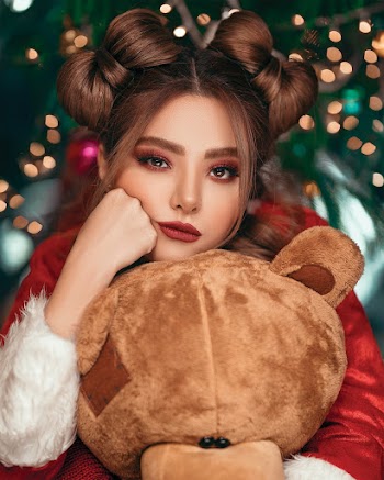 Woman Hugging a Stuffed Toy