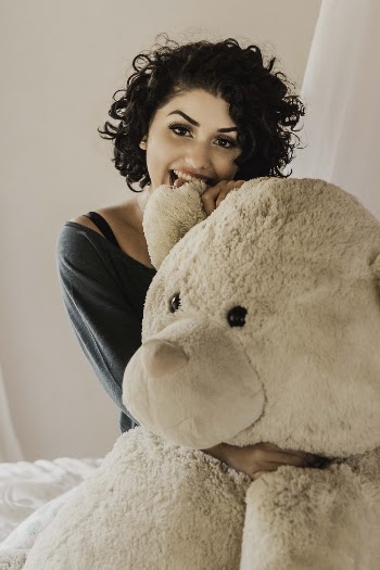 Woman Hugging Bear Plush Toy