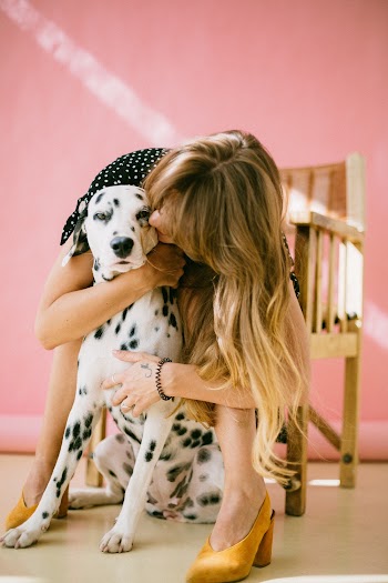 Woman Hugging Dalmatian Dog