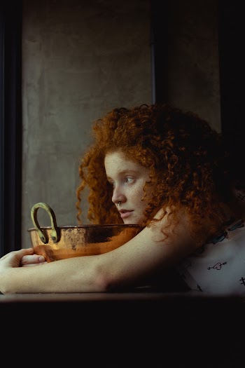 Woman Hugging Gold Basin
